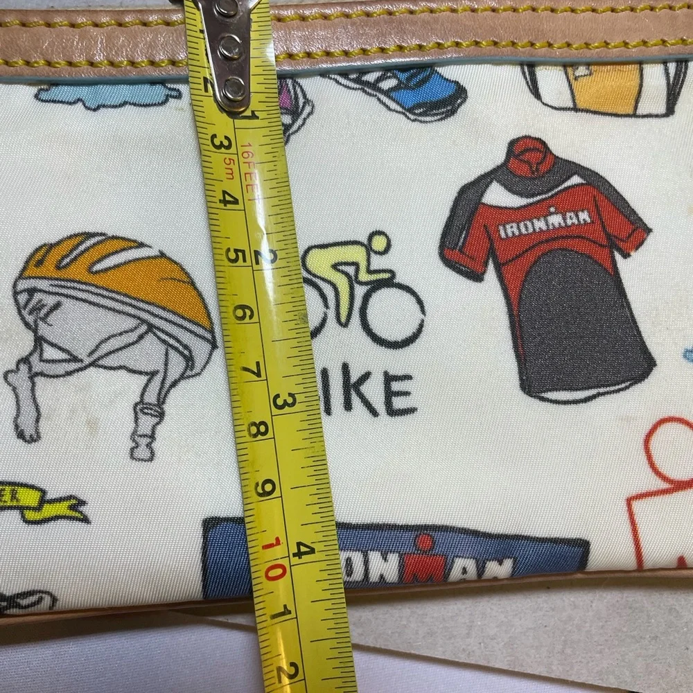 Dooney & Bourke Disney Sketch Marathon Wristlet 70.3 Run is a small wristlet